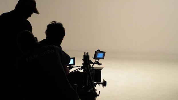 silhouette-of-working-people-or-production-film-crew-are-making-movie-or-shooting-photo